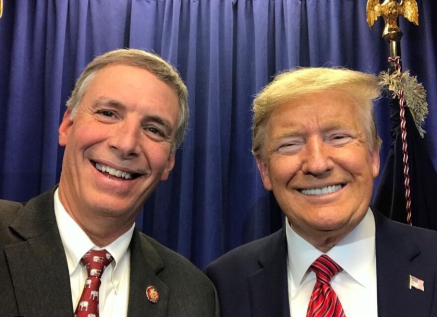 South Carolina Rep. Tom Rice poses with President Trump in happier times -- February 2020 -- during a campaign event.