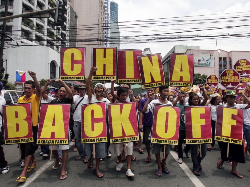 Protesters in Manila, Philippines, marched toward the Chinese consulate during a May rally decrying the standoff between the two nations over the Scarborough Shoal.