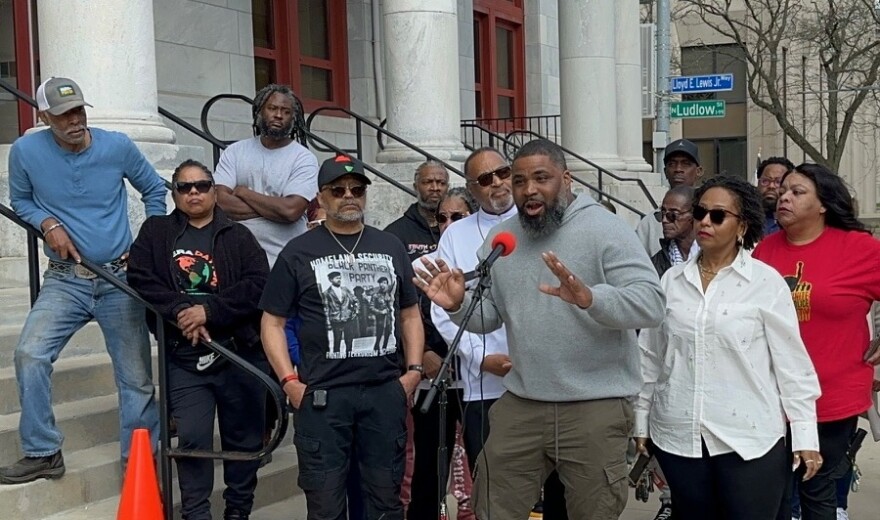 Jared Grandy, former community-police relations coordinator for the City of Dayton, speaks at a press conference on Monday, March 30 about the killing of Reginald Thomas.