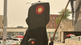 A protester dressed as a Flock Camera at rally in front of Binghamton's City Hall, July 22, 2026.