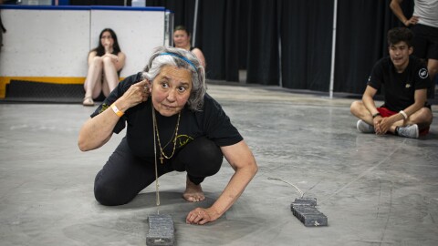 Sheila Rendazzo prepares to lift up 16 pounds of metal with her ear at the World Eskimo-Indian Olympics qualifier on July 19, 2025.