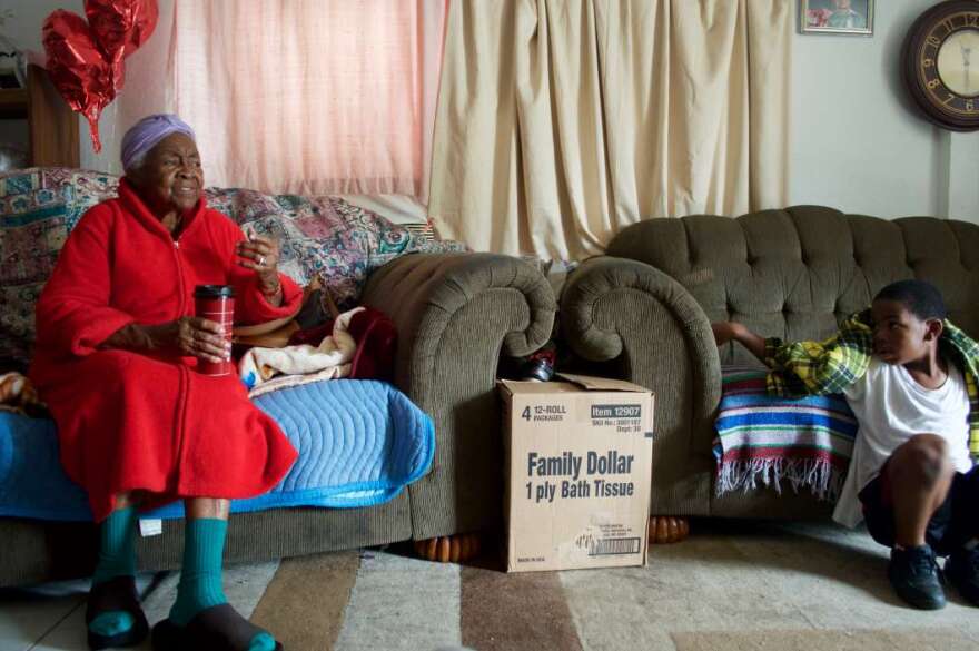 Ms. Emma with her grandson at their home in Eatonville. Photo: Black Florida, Johanne Rahaman.