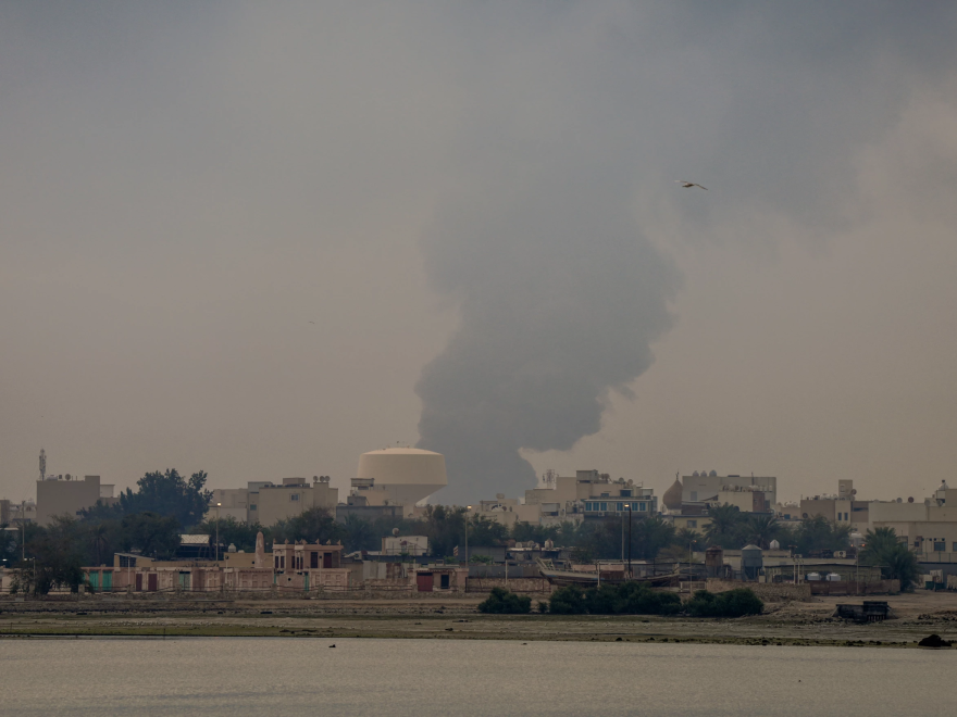 A plume of smoke rises after a reported Iranian strike on fuel tanks in Muharraq, Bahrain, on March 12.