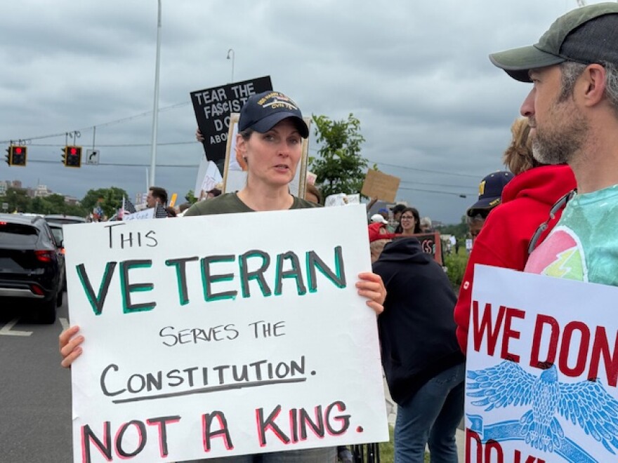 Several veterans attended the No Kings rally holding signs in support of the protest. This sign reads, "This veteran serves the Constitution. Not a King."