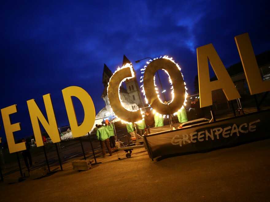 In January, Greenpeace activists lit a campaign banner on fire to protest coal extraction as a church was set for demolition in the German village of Immerath, in the state of Rhineland-Palatinate, to make way for brown coal mining.