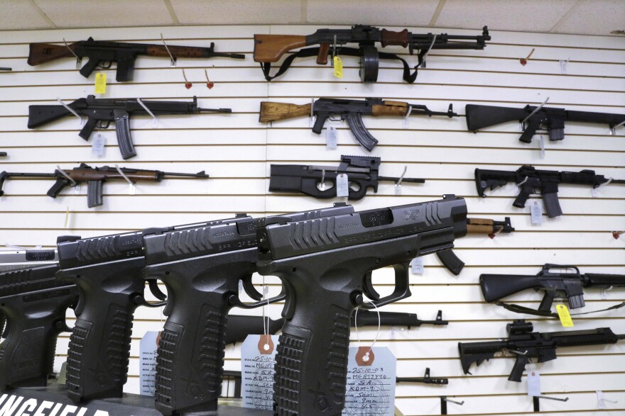 Assault style weapons and hand guns are displayed for sale at Capitol City Arms Supply on Jan. 16, 2013, in Springfield, Ill.
