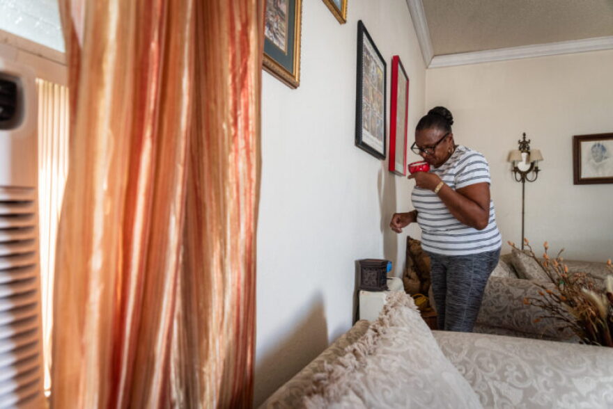 Dorethea Parker inside the living room of her home in the Dixon neighborhood.