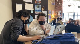 Ryan, right, works on an assignment with a classmate at the Englewood campus of Purdue Polytechnic High School on May 23, 2022 in Indianapolis.