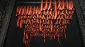 Andouille sausage cooks away in a traditional smokehouse in LaPlace.