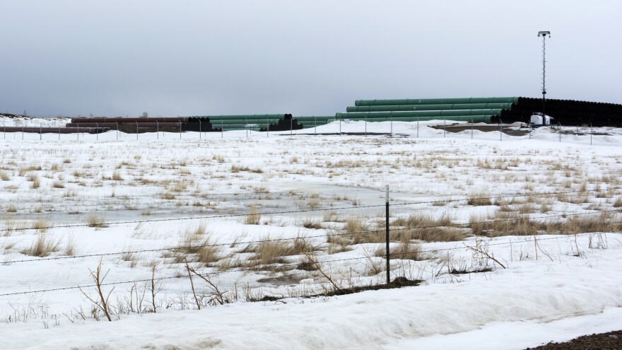 This 2020 photo provided by the Bureau of Land Management shows a storage yard north of Saco, Mont., for pipe that was to be used in construction of the Keystone XL oil pipeline. Biden cancelled the pipeline on his first day in office.