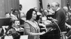 Mrs. Coretta Scott King, widow of the late Dr. Martin Luther King Jr., rehearses in Constitutional Hall for her narration of Aaron Copland's 'Lincoln Portrait,' presented as a part of Abraham Lincoln's 160th birthday anniversary celebration in 1969. At right is the celebrated composer.