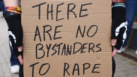 A sign held at a rally for Jane Doe in Ithaca, New York. October 4, 2026
