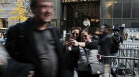 Two women stop to take a selfie from the sidewalk across the street from Trump Tower, where President-elect Donald Trump continued meetings with members of his transition team, Wednesday, Nov. 16, 2016, in New York. (Julie Jacobson/AP)
