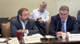 David ‘Chip’ Carter and James Leewright, members of the Statewide Official Compensation Commission, discuss salaries for Oklahoma statewide elected officials during a Wednesday meeting at the Capitol.