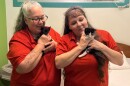 From left: Women's Community Correctional Facility inmates Sherri Ann Johnston and Paulette Paulich holding kittens Junior and Minnie.