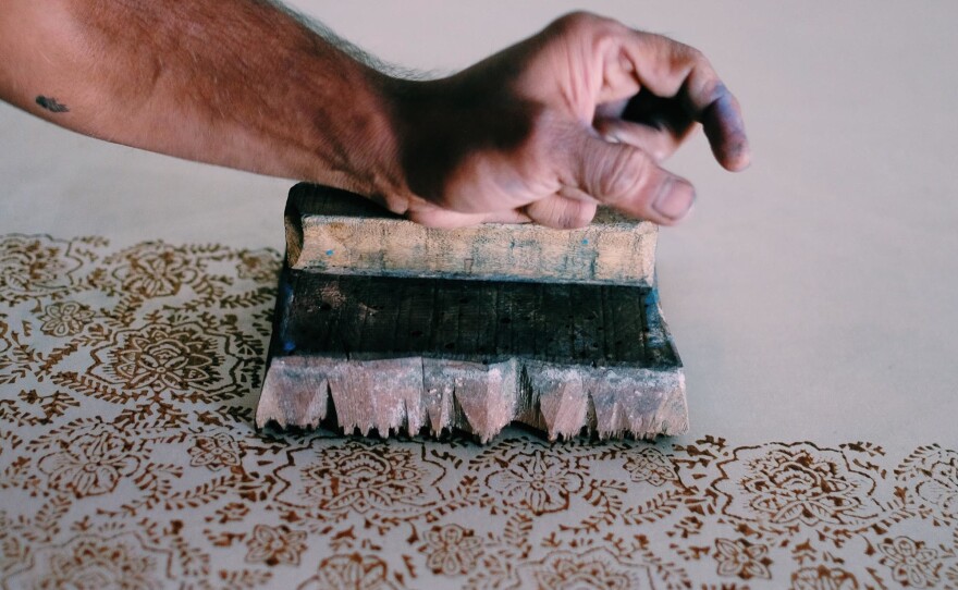 Hand-carved wooden blocks are used to make the prints on the textiles. Some of the blocks are over 200 years old. They're retired when edges turn rough or become uneven.
