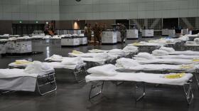 California Air National Guard personnel from the 146th Airlift Wing assist with retrofitting the Los Angeles Convention Center into a federal medical station. The 146th Airlift Wing has been mobilized to provide humanitarian aid across the state of Califo