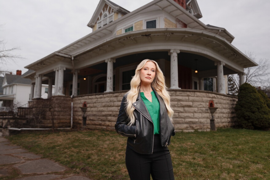 HGTV host Anna Camp stands in front of Bihl Manor in Fremont — the first haunted home to be featured on "A Very Haunted Renovation."