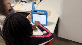 PEAK Literacy tutor Mary Ellen Delaplaine works with Kristina Keith on a reading activity at Sweetwater Square in Gainesville, Fla., on Sept. 16, 2026. Students use tablets and other learning materials during tutoring sessions.