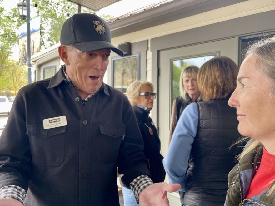 Democratic 3rd Congressional District candidate Dwayne Romero talks to a supporter at Townline Trucks in Carbondale on Oct. 21. Romero is running to unseat Republican Rep. Jeff Hurd in the November midterm elections.