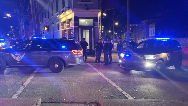 Ohio State Highway Patrol troopers monitor a crime scene near downtown Cincinnati.