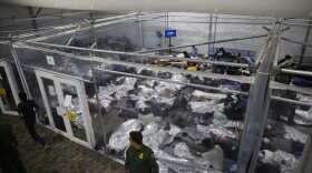 Young children lie inside a pod at the Department of Homeland Security holding facility run by the Customs and Border Patrol (CBP) on March 30, 2021 in Donna, Texas. (Dario Lopez-Mills - Pool/Getty Images)