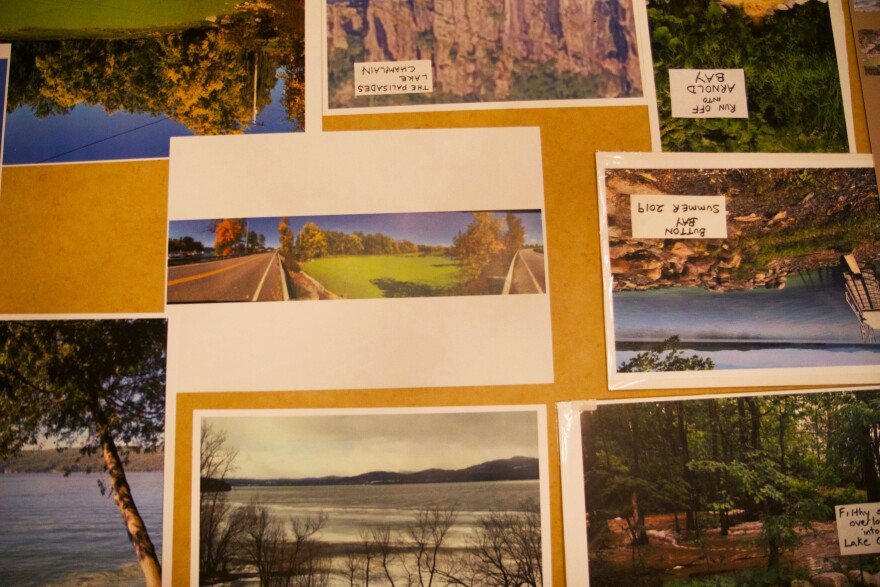 A bunch of different photographs on a table depicting dirty water.