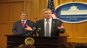 Rep. Bob Cupp (R-Lima) watches as Rep. John Patterson (D-Ashtabula) talks about their new school funding formula.