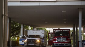 Alachua and Dixie County EMS crews pull outside the UF Health Shands Emergency Room dropoff. (Kasambi Koyaki/WUFT News)