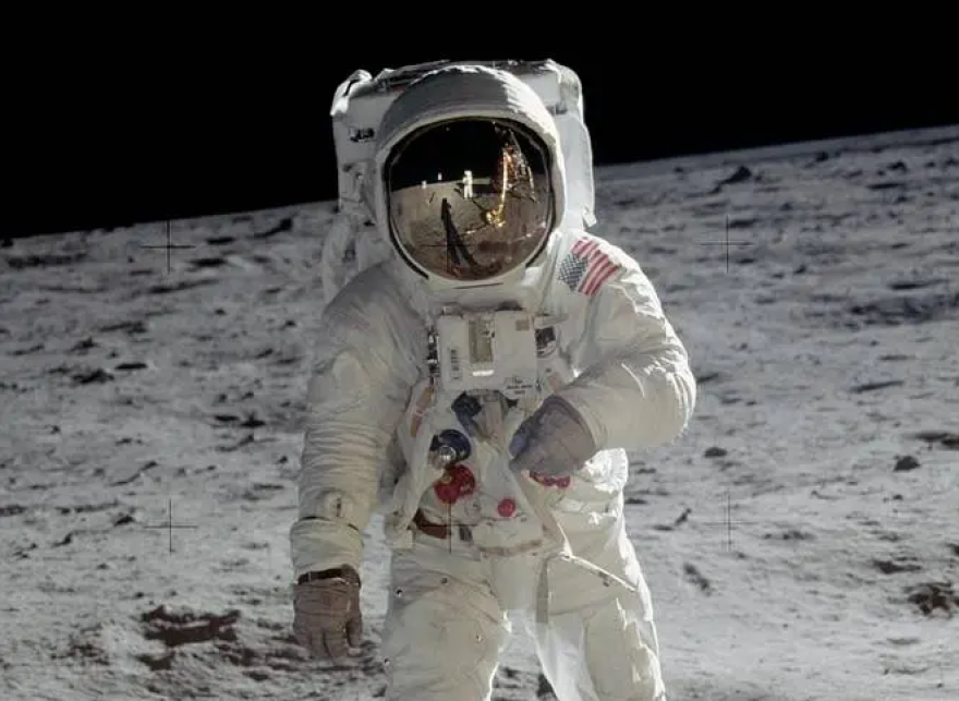 Apollo 11 astronaut Neil Armstrong reflected in the faceplate of Buzz Aldrin on the moon