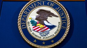 FILE - The Department of Justice seal is seen in Washington, Nov. 28, 2018. (AP Photo/Jose Luis Magana, File)