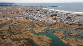 FILE: An aerial photograph of Hampton Beach, New Hampshire on April 15, 2021. Hundreds of homes in the town are prone to flooding as sea levels rise.