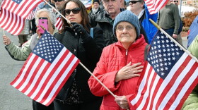 June Powell, an Air Force Veteran from Holyoke stands on South Street on March 29, 3017, to welcome the remains of U.S. Army Cpl. Jules Hauterman Jr., who was killed in North Korea in 1950. 