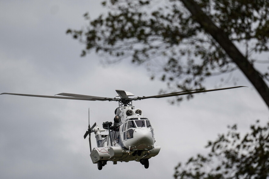 A medical helicopter takes off near downtown in the aftermath of Hurricane Helene, Monday, Sept. 30, 2024, in Asheville, (AP Photo/Mike Stewart)