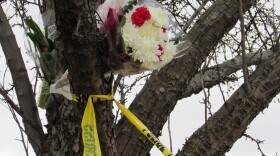 File photo of flowers left near the Cracker Barrel restaurant in Texas Township, one scene of a Kalamazoo Area shooting spree in 2016. Photo by Gordon Evans, WMUK