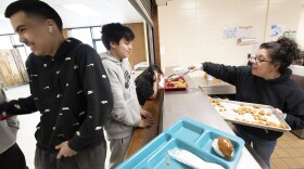 Brothers Noah and Elijah Standifer go back for second servings of lunch from Principal Christy Gomez at Tebughna School. Staff in the smaller Kenai Peninsula Borough Schools often serve multiple roles.