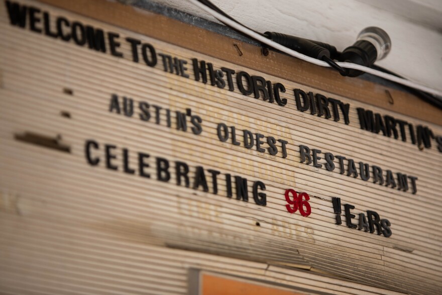 A sign at Dirty Martin's that reads: "Welcome to the Historic Dirty Martin's. Austin's Oldest Restaurant Celebrating 96 Years."