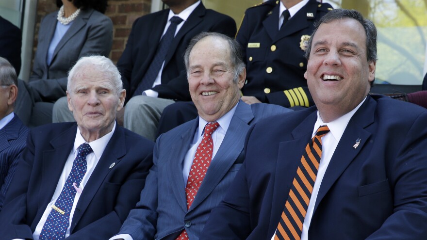 New Jersey Gov. Chris Christie, right, sits with former Governors Brendan Byrne, left, and Thomas H. Kean, Sr., at the opening of a new prisoner re-entry center in Sept. 2014, in Jersey City, N.J.