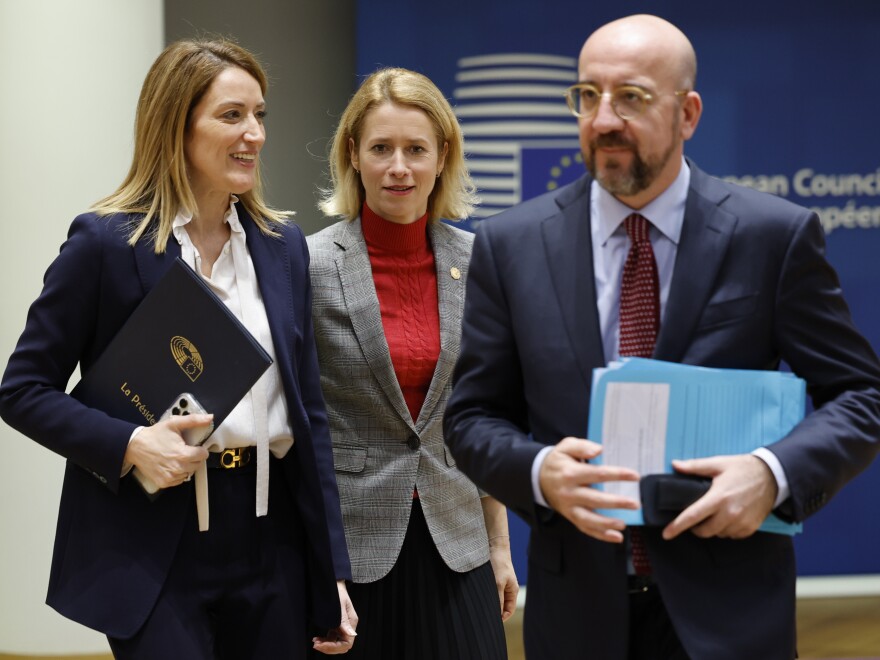 From left, European Parliament President Roberta Metsola, Estonia's Prime Minister Kaja Kallas and European Council President Charles Michel arrive to a round table meeting at an EU summit in Brussels, Thursday. "Ukraine is our priority and this agreement will give the credibility, legitimacy and the predictability that is expected from us," Metsola said.