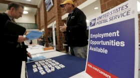 In this Thursday, Nov. 2, 2017, photo, a recruiter from the postal service, right, speaks with an attendee of a job fair in Cheswick, Pa. On Thursday, Dec. 7, 2017, the Labor Department reported that the number of unemployed workers filing for jobless benefits fell by 2,000 a week earlier to 236,000, the lowest level in five weeks and further evidence of the strength in the labor market. (Keith Srakocic/AP)