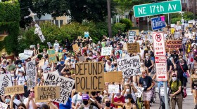Demonstrators march against racism and police brutality and to defund the Minneapolis Police Department on June 6, 2020 in Minneapolis. (Kerem Yucel/AFP/Getty Images)