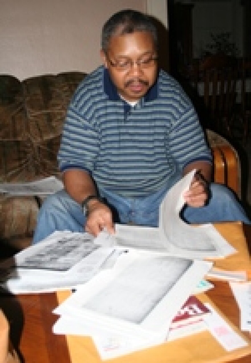 Cherokee Freedman Johnny Toomer looks over documents linking him to the tribe.