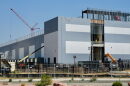 A large warehouse looking building under construction.
