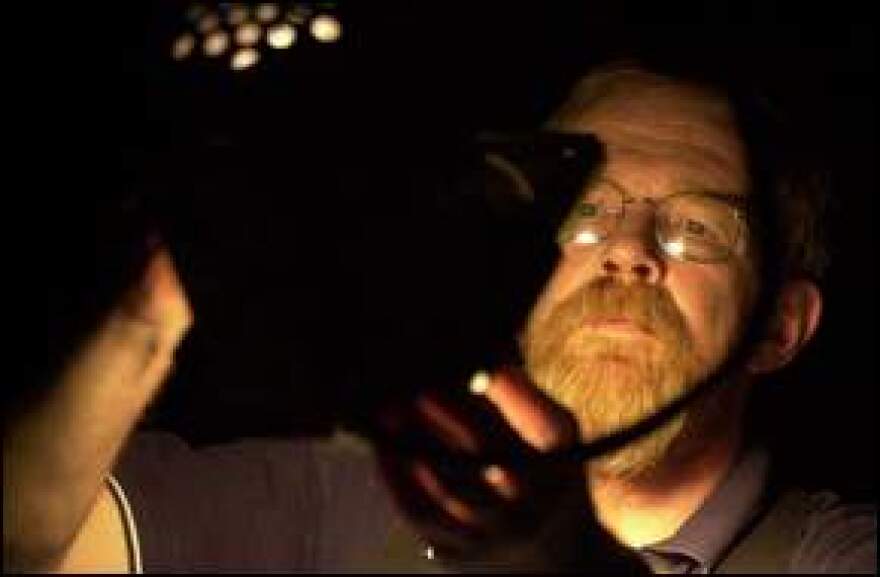 Charlie Dennis changing a stage light in 2001.