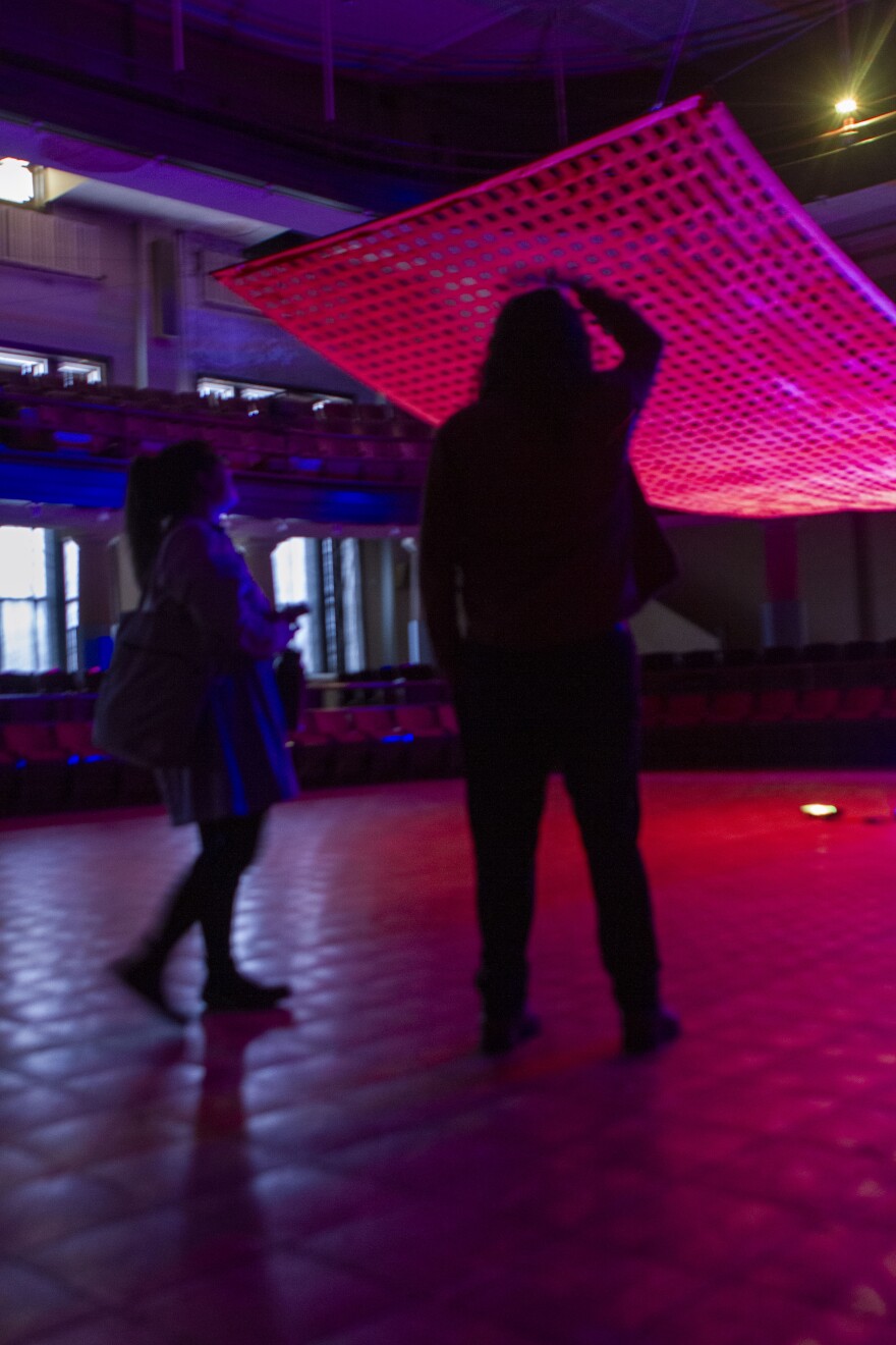 Anna Vanessa and Daniel Picking admires the tapestry. Vanessa and Garrett Breese will be performing music at the exhibit on April 10.