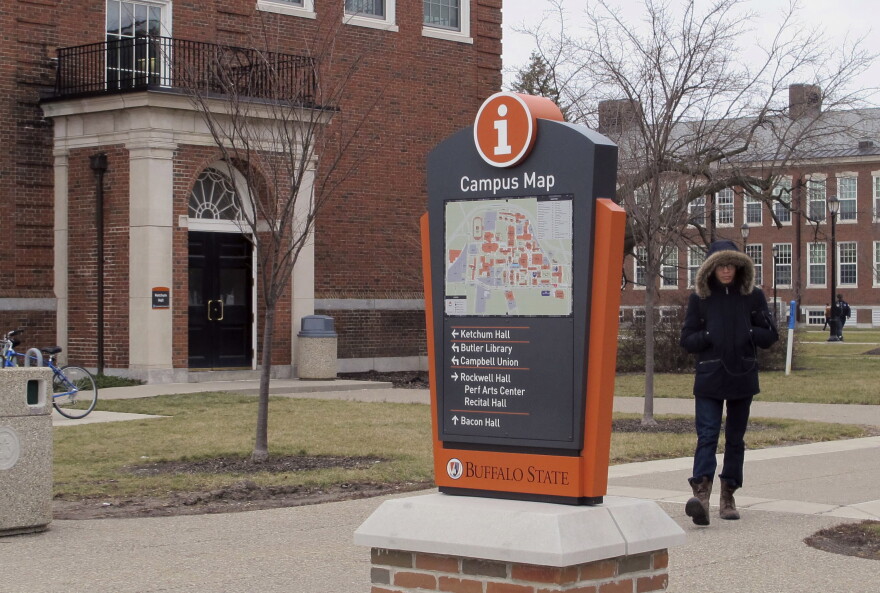 In this Jan. 27, 2017, file photo, a student goes about his day on the Buffalo State College campus in Buffalo, N.Y. Students attending college at one of New York's public universities in the spring of 2021 will have to quarantine at home for a week first and be tested for COVID-19 when they arrive on campus, officials announced Sunday, Nov. 8, 2020. (Carolyn Thompson/AP)