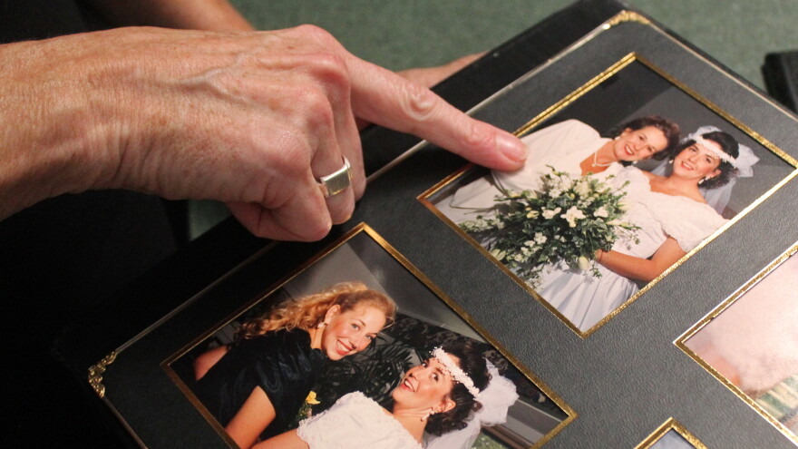 Amy Pawlus points to a photo of her mother, Shelby Boaz, pictured at Amy’s wedding in 1994. Boaz died in 2018, and Pawlus settled her lawsuit against NeuroPsychiatric Hospitals in 2026.