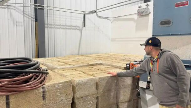 Danny Dejarlais, who runs the Lower Sioux Indian Community’s hempcrete business, points out hempcrete blocks manufactured and stored in its warehouse on the reservation | MPR News