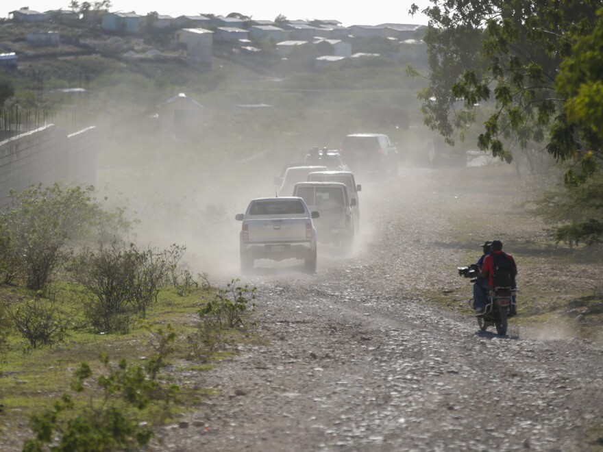 A caravan drives to the airport after departing from the Christian Aid Ministries headquarters at Titanyen, north of Port-au-Prince, Haiti, Dec. 16, 2021.