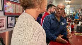 Republican Senate candidate Don Bolduc talks to patrons at the Red Arrow Diner in Manchester, Oct. 3, 2022.